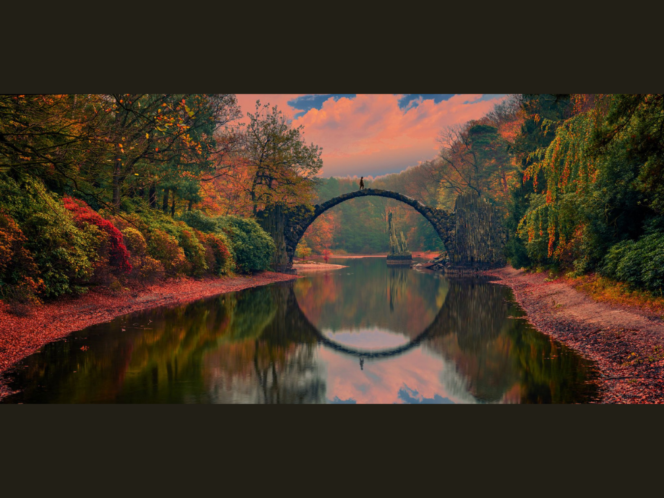 picture is of person walking across devils bridge...