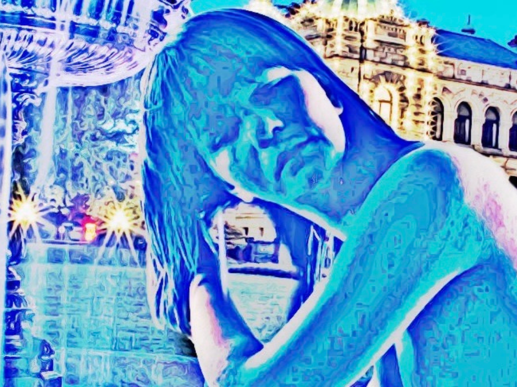 A Lady with wet hair in the fountain